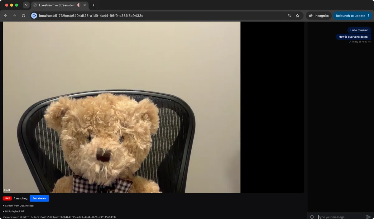 Stream's LivestreamPlayer and chat component running side by side: a host's camera feed on the left with LIVE and viewer-count indicators, and a live chat panel on the right showing messages from viewers