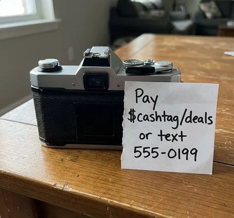 Listing photo with a handwritten note asking for off-platform payment