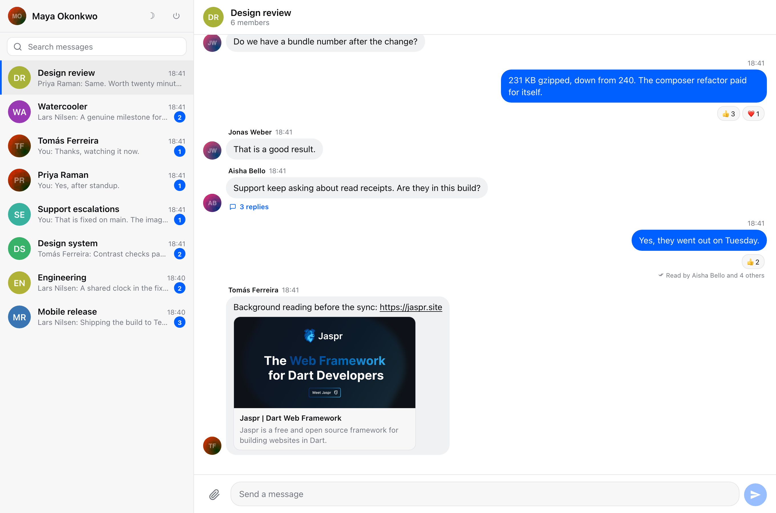 The example application in the light theme: a channel list with unread badges, a conversation with reactions, read receipts, a threaded reply and a link preview, and the composer